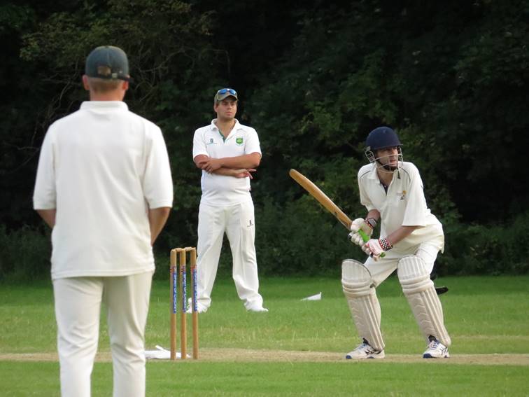 A group of people playing cricket

Description automatically generated with low confidence
