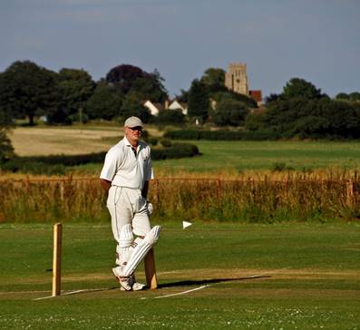 A person playing cricket

Description automatically generated with low confidence
