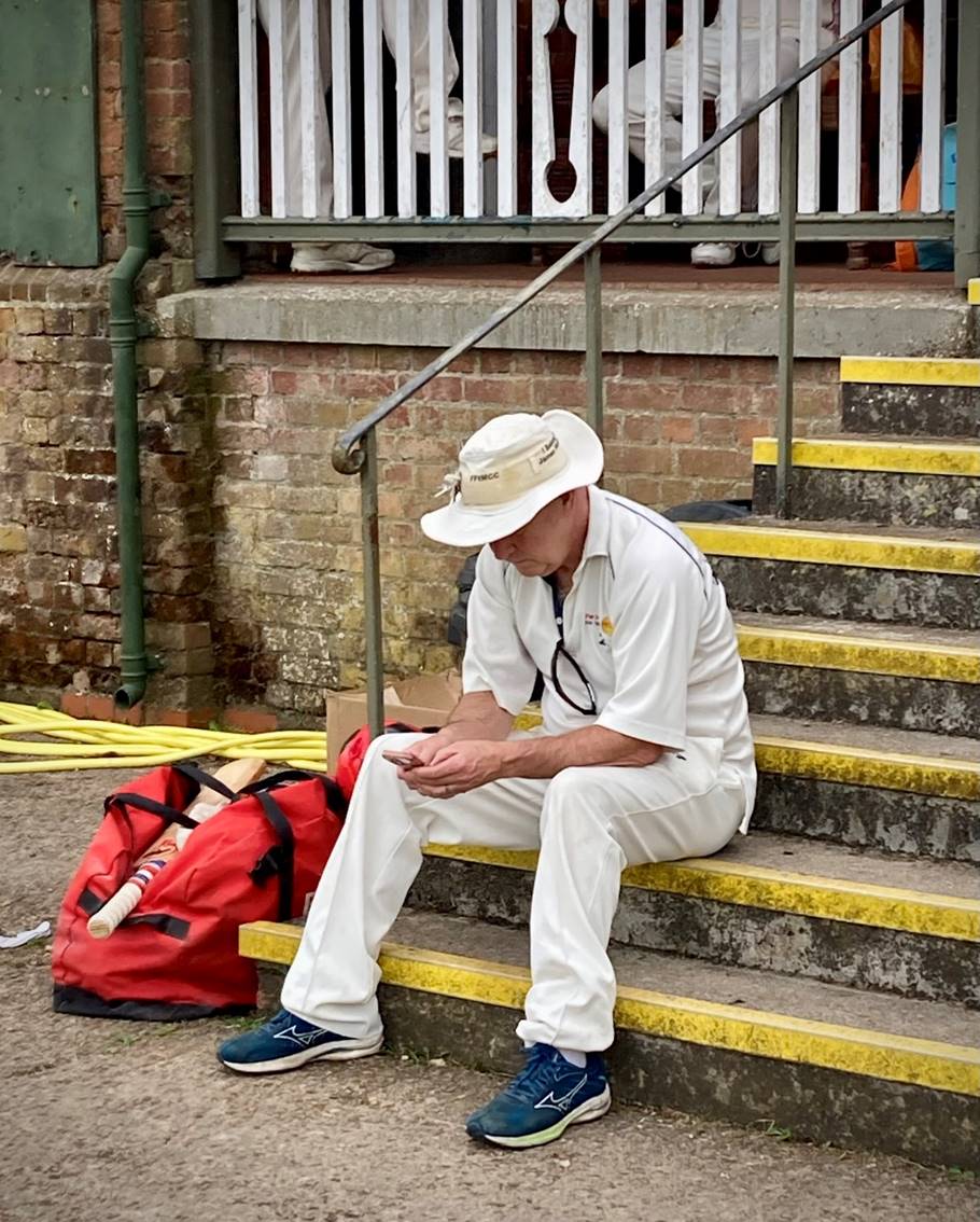 A person sitting on stairs

Description automatically generated