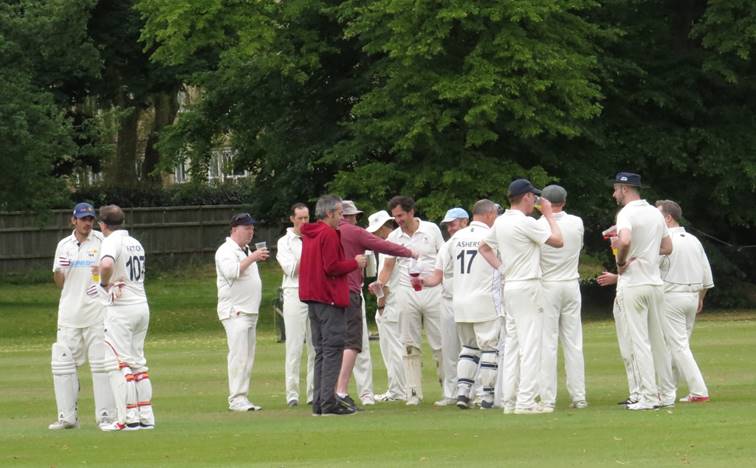 A group of people in white sports uniforms

Description automatically generated