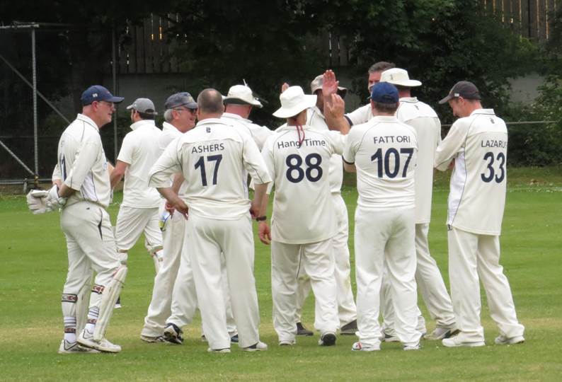 A group of men in white uniforms

Description automatically generated