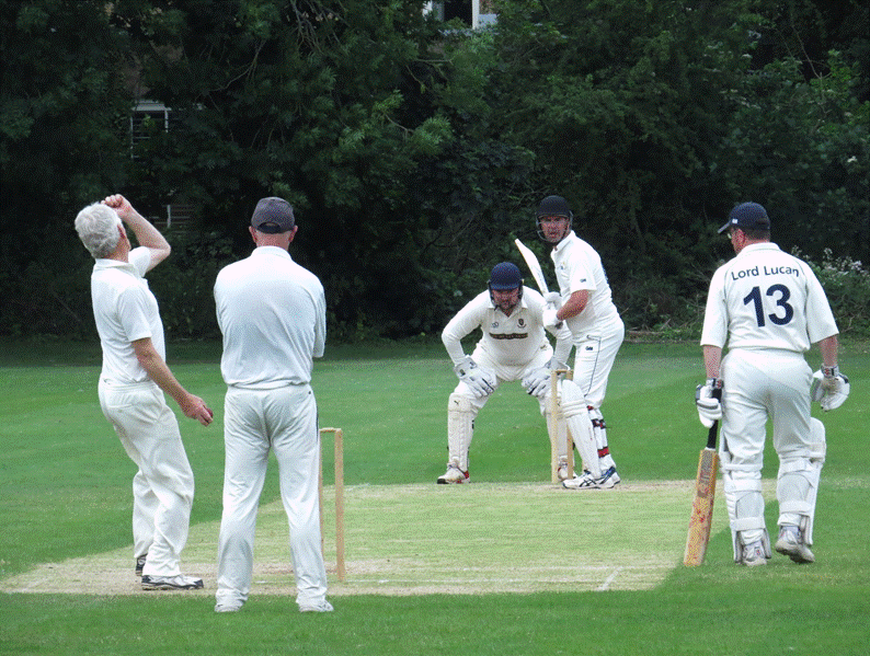 A group of men playing cricket

Description automatically generated