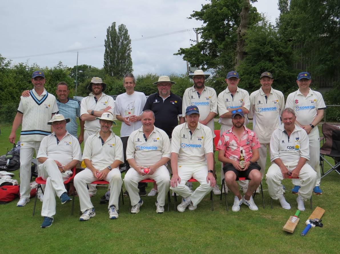 A group of men in matching outfits posing for a photo

Description automatically generated